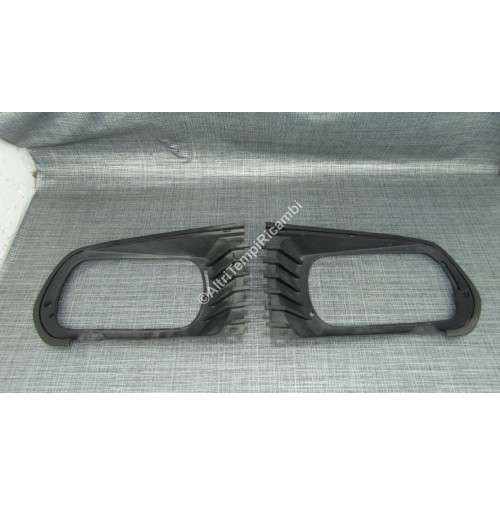 7700536718 COPPIA CORNICI FARI PER RENAULT R12