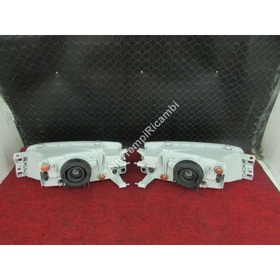 COPPIA FARI PROIETTORI ANTERIORI PER MITSUBISHI LANCER '95 CK2 214-1140-LD-1