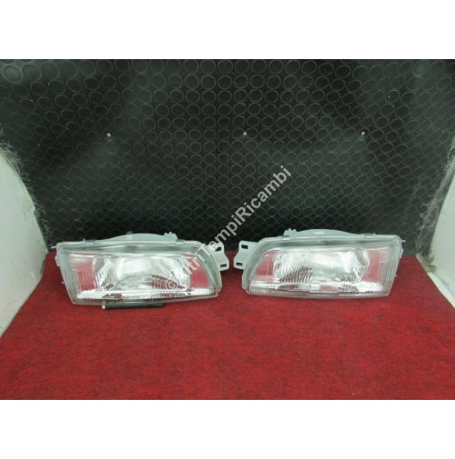 COPPIA FARO PROIETTORE ANTERIORI MITSUBISHI LANCER '93 4G92 C88A C13 C14A ELAR